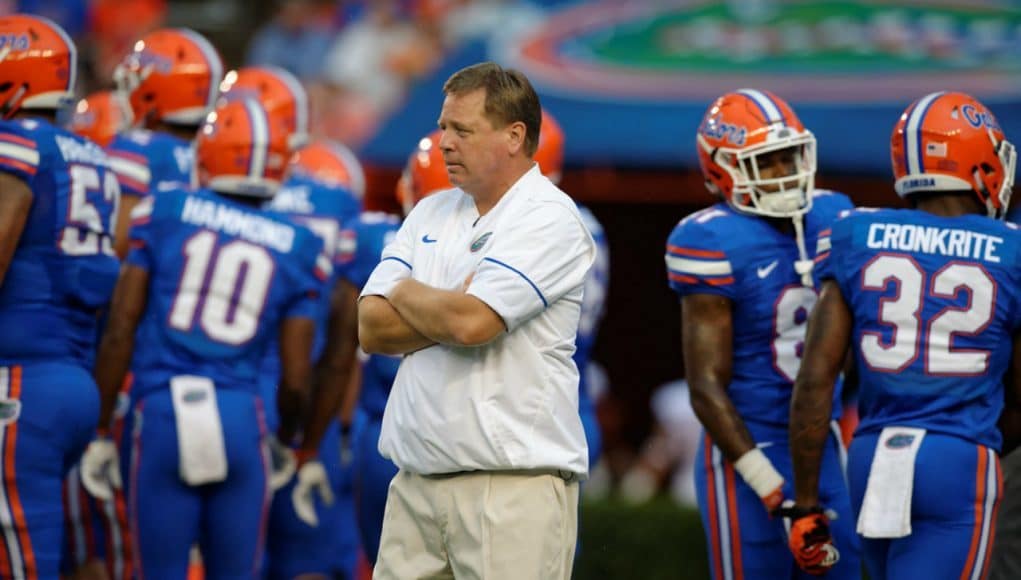 Florida Gators head coach Jim McElwain watches his team before the UMass game- 1280x853