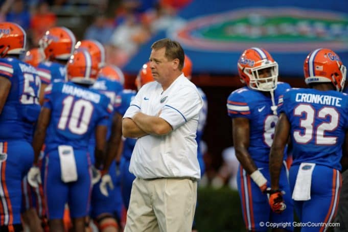 Florida Gators head coach Jim McElwain watches his team before the UMass game- 1280x853