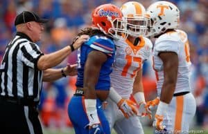 Florida Gators linebacker Daniel McMillan jaws with a Tennessee football player- 1280x853