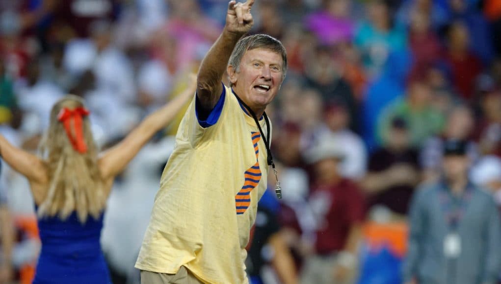 Former University of Florida head coach Steve Spurrier leads the crowd at Ben Hill Griffin Stadium in the Two Bits cheer- Florida Gators football- 1280x852