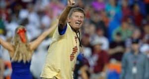 Former University of Florida head coach Steve Spurrier leads the crowd at Ben Hill Griffin Stadium in the Two Bits cheer- Florida Gators football- 1280x852