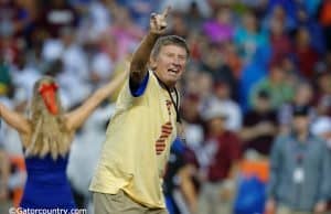 Former University of Florida head coach Steve Spurrier leads the crowd at Ben Hill Griffin Stadium in the Two Bits cheer- Florida Gators football- 1280x852