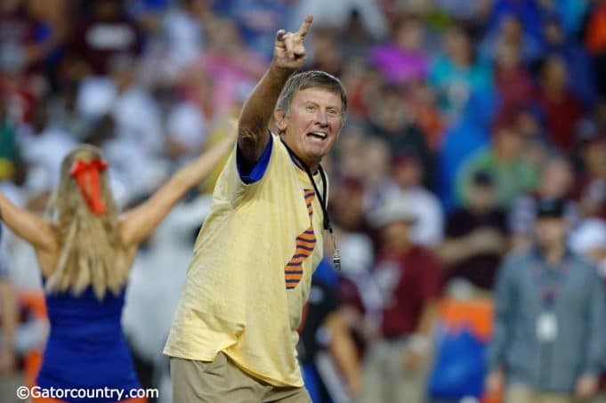 Former University of Florida head coach Steve Spurrier leads the crowd at Ben Hill Griffin Stadium in the Two Bits cheer- Florida Gators football- 1280x852