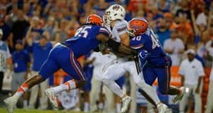 Jarrad Davis (40) and Keivonnis Davis (95) combine to sac UMass quarterback Ross Comis in the 2016 season opener- Florida Gators football- 1280x852