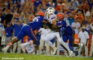 Jarrad Davis (40) and Keivonnis Davis (95) combine to sac UMass quarterback Ross Comis in the 2016 season opener- Florida Gators football- 1280x852