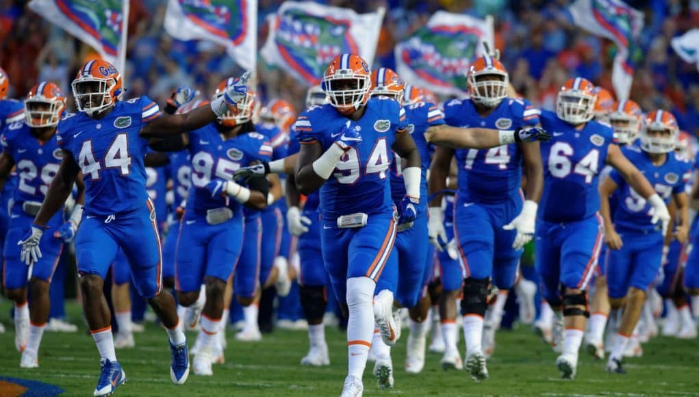 University of Florida senior defensive lineman Bryan Cox Jr. leads the team out onto the field before the home opener against UMass- Florida Gators football- 1280x852