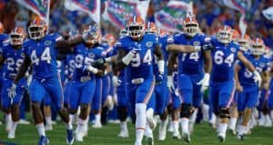 University of Florida senior defensive lineman Bryan Cox Jr. leads the team out onto the field before the home opener against UMass- Florida Gators football- 1280x852