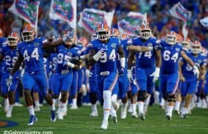 University of Florida senior defensive lineman Bryan Cox Jr. leads the team out onto the field before the home opener against UMass- Florida Gators football- 1280x852