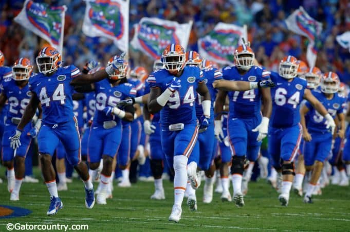 University of Florida senior defensive lineman Bryan Cox Jr. leads the team out onto the field before the home opener against UMass- Florida Gators football- 1280x852