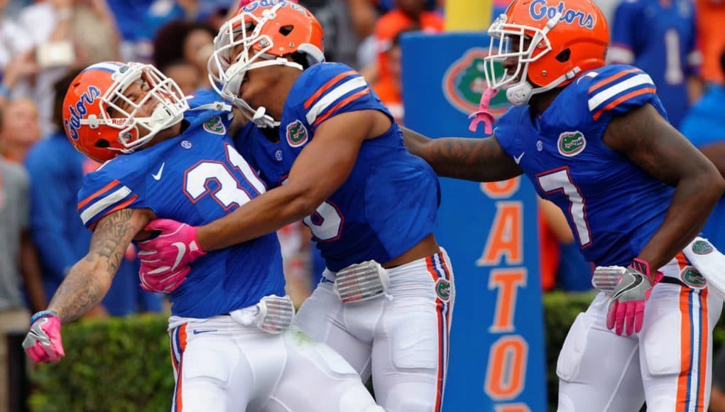 Florida Gators defensive back Teez Tabor celebrates with his teammates- 1280x853