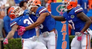 Florida Gators defensive back Teez Tabor celebrates with his teammates- 1280x853