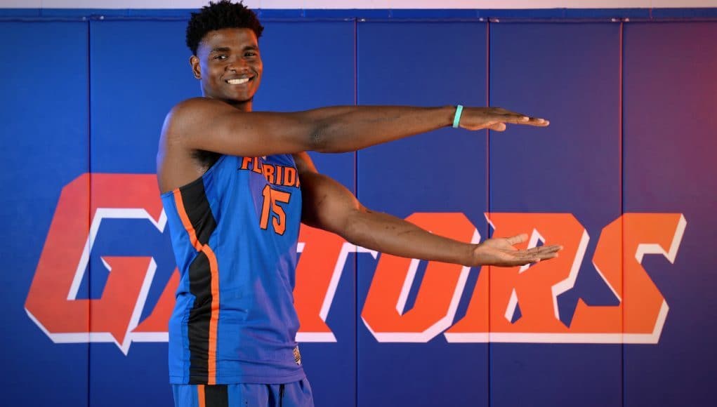 University of Florida big man John Egbunu chomps during basketball media day- Florida Gators basketball- 1280 x866