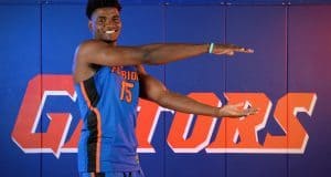 University of Florida big man John Egbunu chomps during basketball media day- Florida Gators basketball- 1280 x866