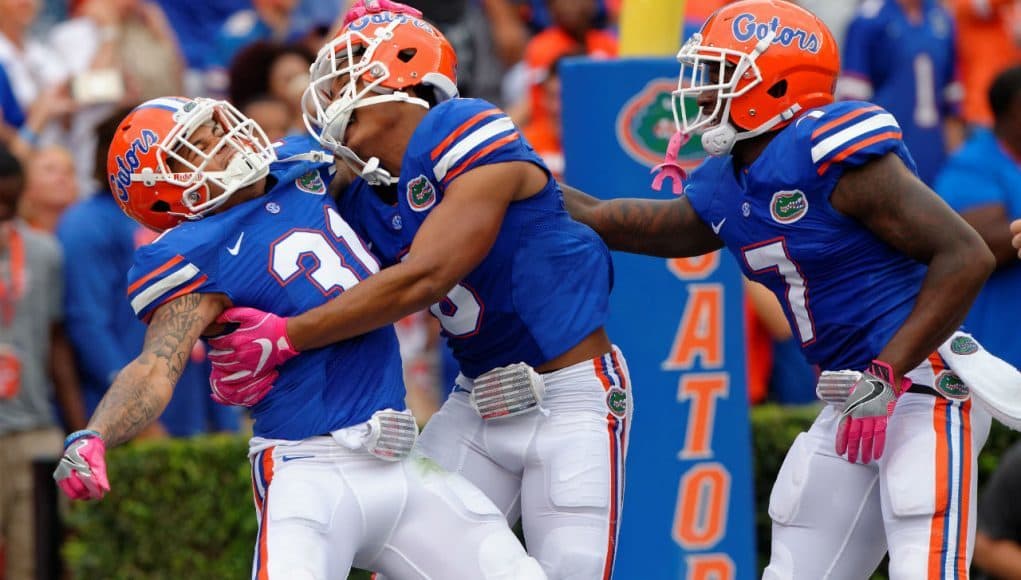 University of Florida cornerbacks Jalen Tabor, Duke Dawson and Quincy Wilson celebrate Wilson’s pick six against Missouri- Florida Gators football- 1280x852