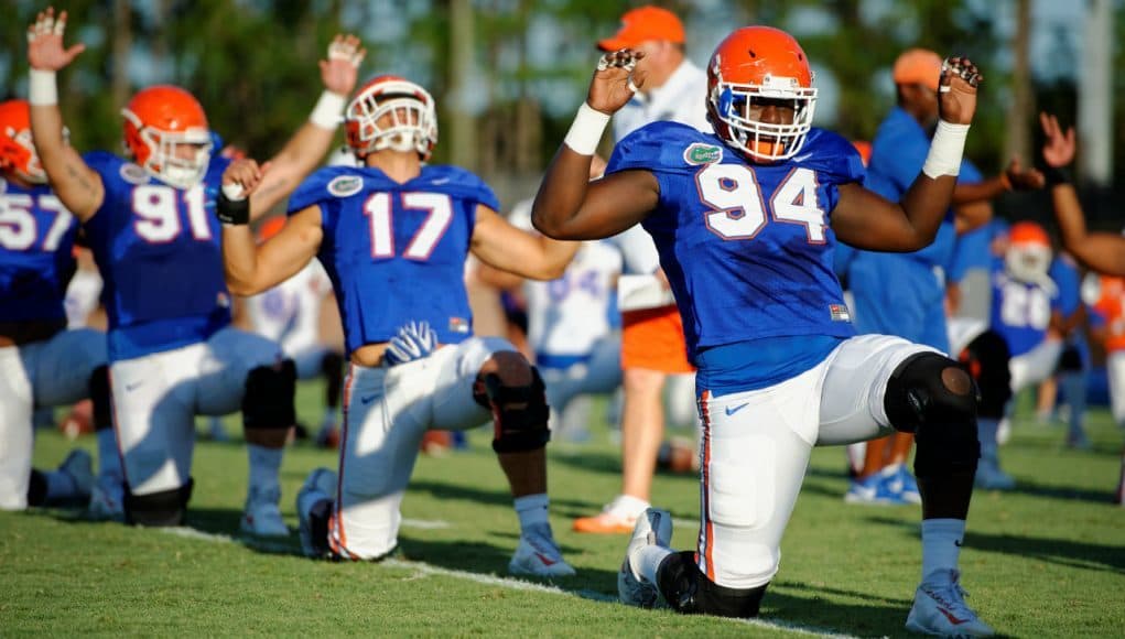University of Florida defensive lineman Bryan Cox Jr. goes through stretched before a practice during fall camp- Florida Gators football- 1280x852