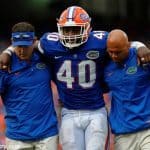 University of Florida linebacker Jarrad Davis is helped off of the field after sustaining an injury against Missouri- Florida Gators football-1280x852