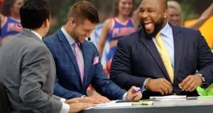 SEC Network analyst Marcus Spears and Tim Tebow laugh on set of SEC Nation during a broadcast in Gainesville- Florida Gators football- 1280x852