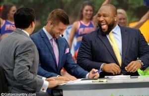 SEC Network analyst Marcus Spears and Tim Tebow laugh on set of SEC Nation during a broadcast in Gainesville- Florida Gators football- 1280x852