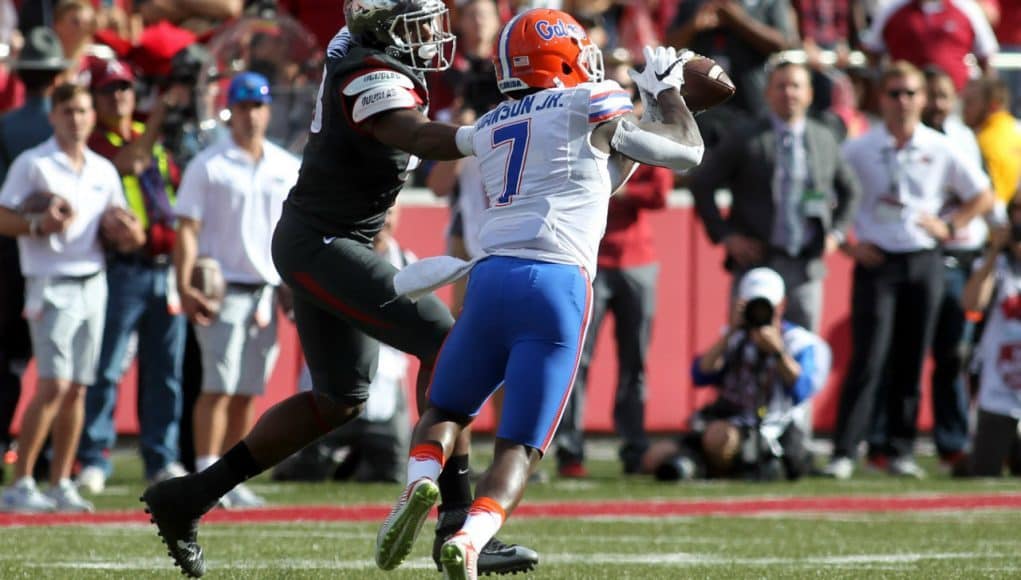 Nov 5, 2016; Fayetteville, AR, USA; Florida Gators defensive back Duke Dawson (7) intercepts a pass and scores a touchdown in the first quarter against the Arkansas Razorbacks at Donald W. Reynolds Razorback Stadium. Mandatory Credit: Nelson Chenault-USA TODAY Sports