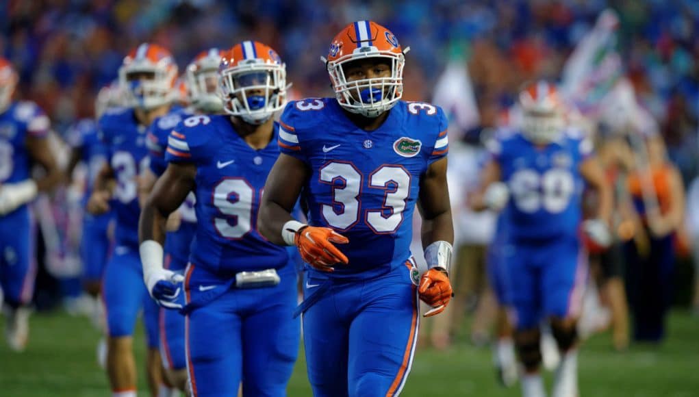 University of Florida freshman linebacker David Reese runs out onto the field for his first collegiate game with the Florida Gators- Florida Gators football- 1280x852