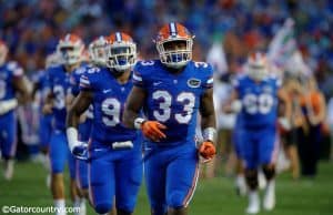 University of Florida freshman linebacker David Reese runs out onto the field for his first collegiate game with the Florida Gators- Florida Gators football- 1280x852