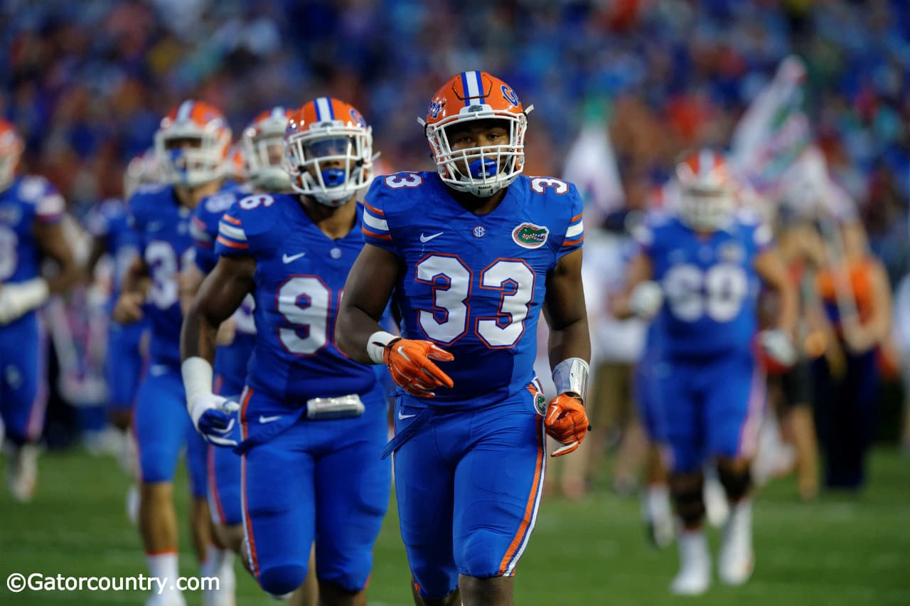University of Florida freshman linebacker David Reese runs out onto the field for his first collegiate game with the Florida Gators- Florida Gators football- 1280x852