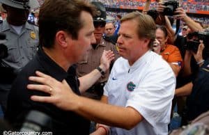 University of Florida head coach Jim McElwain meets Will Muschamp at midfield after the Gators beat the Gamecocks 20-7- Florida Gators football- 1280x852