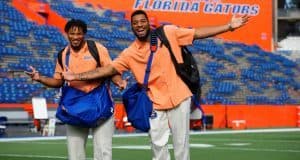 University of Florida senior Mark Herndon and sophomore CeCe Jefferson walk across Florida Field during Gator Walk - Florida Gators football- 1250x852