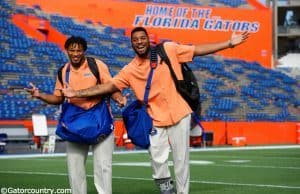 University of Florida senior Mark Herndon and sophomore CeCe Jefferson walk across Florida Field during Gator Walk - Florida Gators football- 1250x852