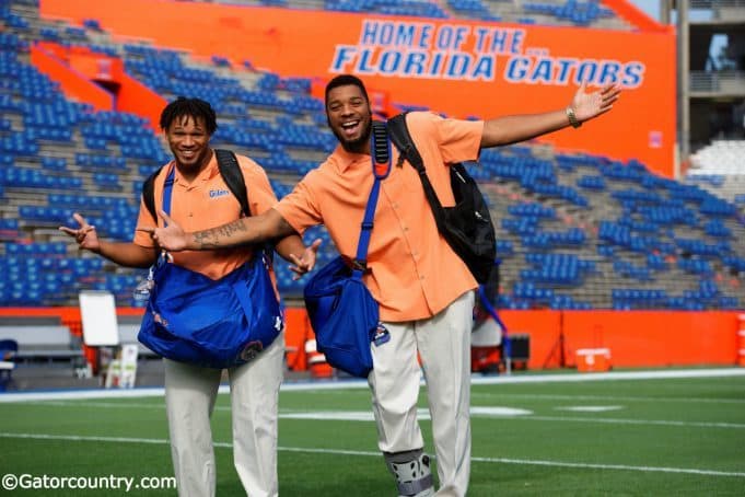 University of Florida senior Mark Herndon and sophomore CeCe Jefferson walk across Florida Field during Gator Walk - Florida Gators football- 1250x852