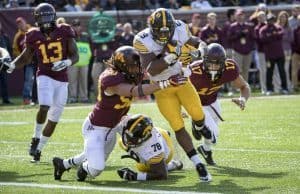 Oct 8, 2016; Minneapolis, MN, USA; Iowa Hawkeyes running back LeShun Daniels Jr. (29) rushes for a two point conversion as Minnesota Golden Gophers linebacker Jack Lynn (50) attempts to make a stop in the second half at TCF Bank Stadium. The Hawkeyes won 14-7. Mandatory Credit: Jesse Johnson-USA TODAY Sports