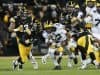 Nov 12, 2016; Iowa City, IA, USA; Michigan Wolverines running back Chris Evans (12) carries the ball as Iowa Hawkeyes defensive back Anthony Gair (12) and defensive back Desmond King (14) tackle during the first half at Kinnick Stadium. Mandatory Credit: Reese Strickland-USA TODAY Sports