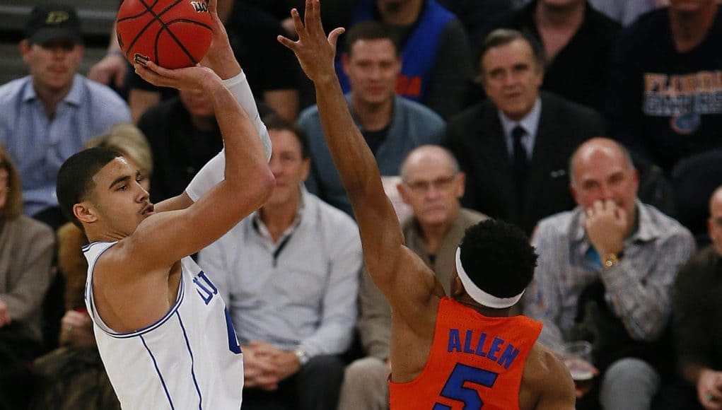 Dec 6, 2016; New York, NY, USA; Duke Blue Devils forward Jayson Tatum (0) shoots over Florida Gators guard KeVaughn Allen (5) during first half at Madison Square Garden. Mandatory Credit: Noah K. Murray-USA TODAY Sports