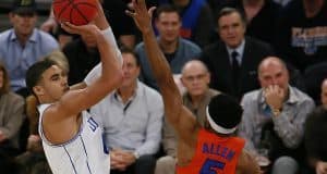 Dec 6, 2016; New York, NY, USA; Duke Blue Devils forward Jayson Tatum (0) shoots over Florida Gators guard KeVaughn Allen (5) during first half at Madison Square Garden. Mandatory Credit: Noah K. Murray-USA TODAY Sports