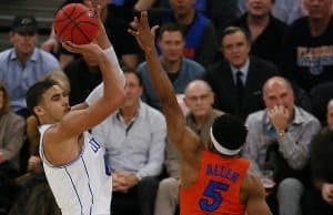 Dec 6, 2016; New York, NY, USA; Duke Blue Devils forward Jayson Tatum (0) shoots over Florida Gators guard KeVaughn Allen (5) during first half at Madison Square Garden. Mandatory Credit: Noah K. Murray-USA TODAY Sports