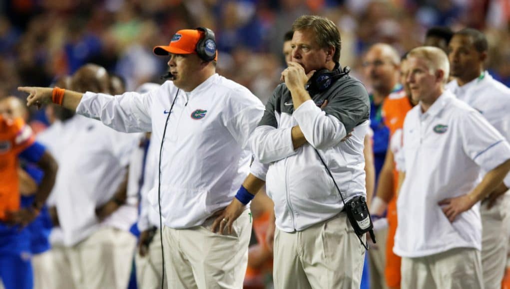 University of Florida head coach Jim McElwain and defensive coordinator Geoff Collins on the sideline during the SEC Championship- Florida Gators football- 1280x852