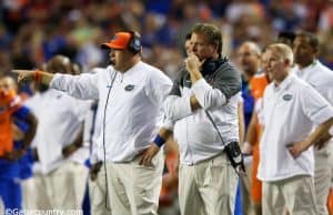 University of Florida head coach Jim McElwain and defensive coordinator Geoff Collins on the sideline during the SEC Championship- Florida Gators football- 1280x852