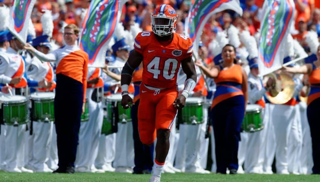 University of Florida linebacker Jarrad Davis runs out on to the field before the Gators game against Kentucky- Florida Gators football- 1280x852