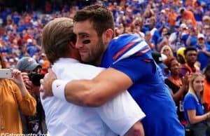University of Florida quarterback Austin Appleby embraces head coach Jim McElwain during senior day ceremonies- Florida Gators football- 1280x855