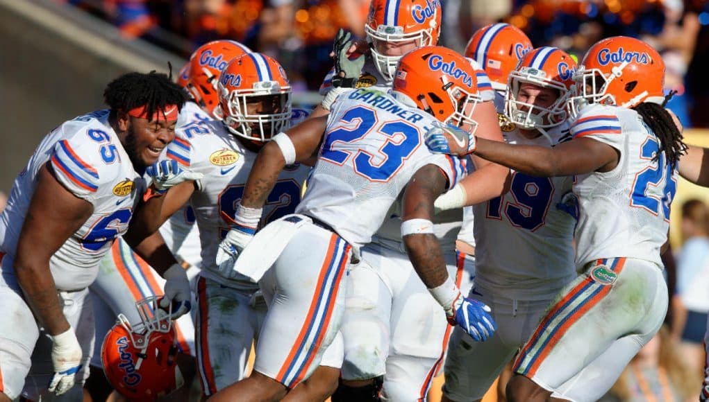 Chauncey Gardner is mobbed by teammates after returning an interception 58 yards for a score against Iowa in the Outback Bowl- Florida Gators football- 1280x852