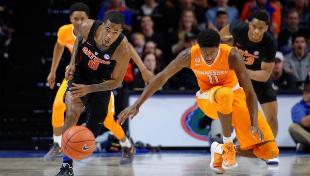 Florida Gators basketball guard Kasey Hill goes for the steal against Tennessee- 1280x853