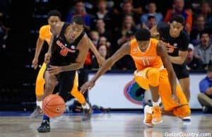 Florida Gators basketball guard Kasey Hill goes for the steal against Tennessee- 1280x853