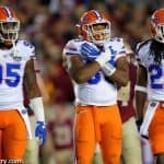 University of Florida defensive players Keivonnis Davis, David Reese and Marcell Harris on the field against Florida State- Florida Gators football- 1280x852