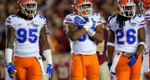 University of Florida defensive players Keivonnis Davis, David Reese and Marcell Harris on the field against Florida State- Florida Gators football- 1280x852