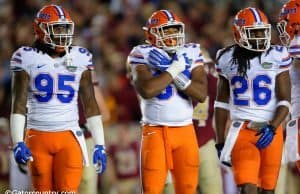 University of Florida defensive players Keivonnis Davis, David Reese and Marcell Harris on the field against Florida State- Florida Gators football- 1280x852