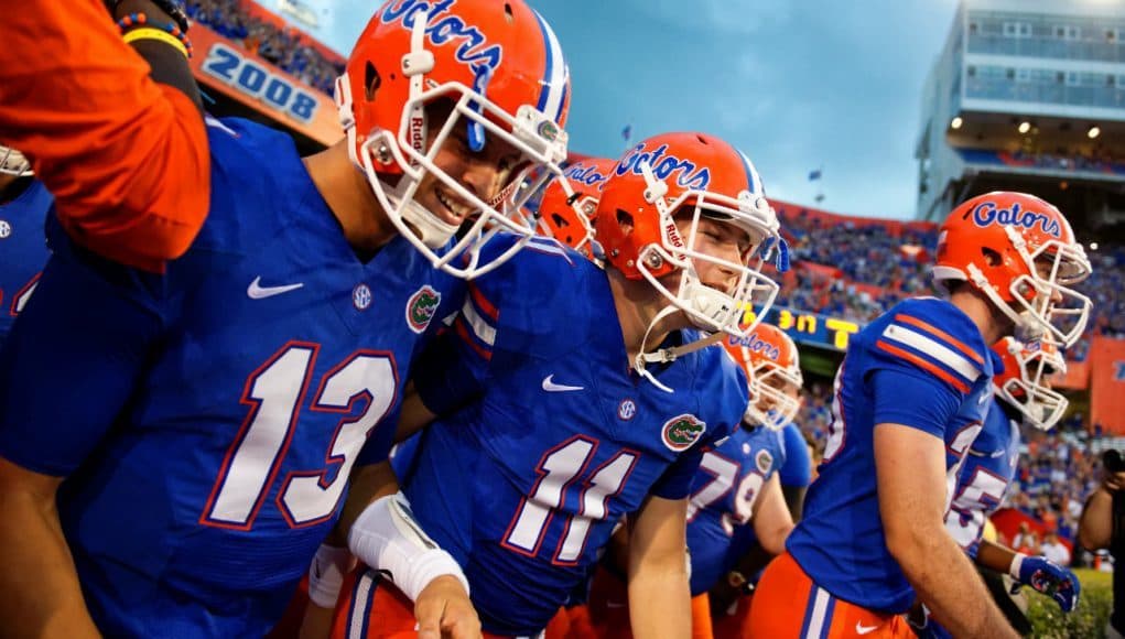 University of Florida freshmen quarterbacks Feleipe Franks (13) and Kyle Trask (11) run out onto the field to take on North Texas- Florida Gators football- 1280x855