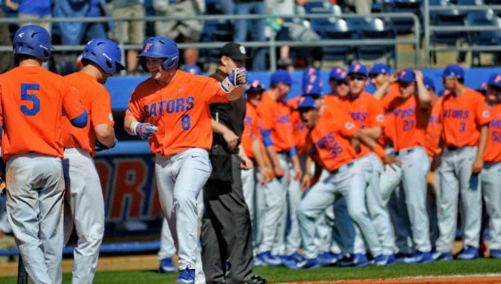 Florida Gators infielder Deacon Liput celebrates with his teammates after a home run against William & Mary- Florida Gators baseball- 1280x852