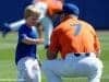 University of Florida head baseball coach Kevin O’Sullivan plays with his son Finn before the Gators final game against Miami- Florida Gators baseball- 1280x852