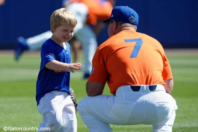 University of Florida head baseball coach Kevin O’Sullivan plays with his son Finn before the Gators final game against Miami- Florida Gators baseball- 1280x852