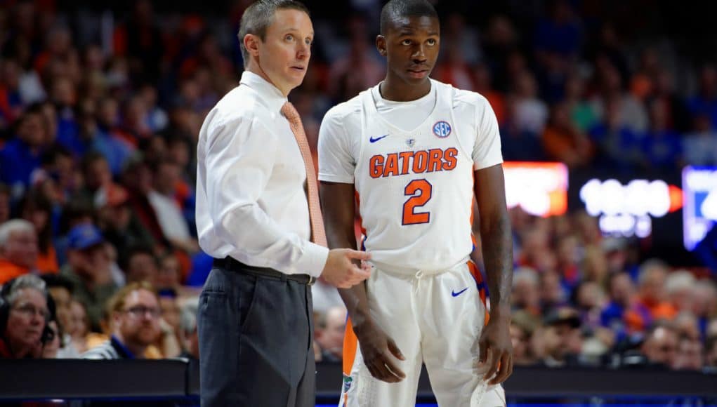 University of Florida men’s basketball coach Mike White talks to guard Eric Hester during a blowout win over the Kentucky Wildcats- Florida Gators basketball- 1280x852